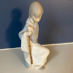 Lladro kneeling boy figurine